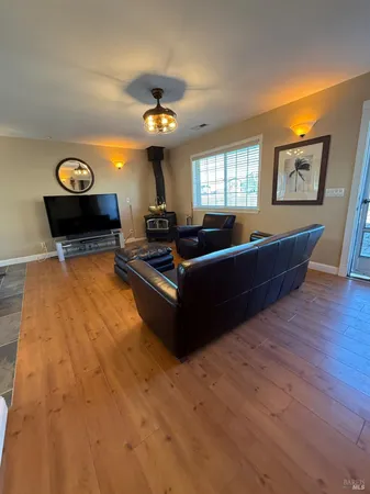 a bedroom with bed and a chandelier