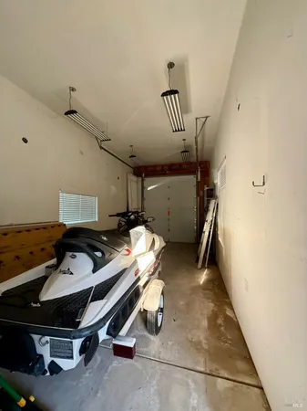 a view of a backyard with wooden fence