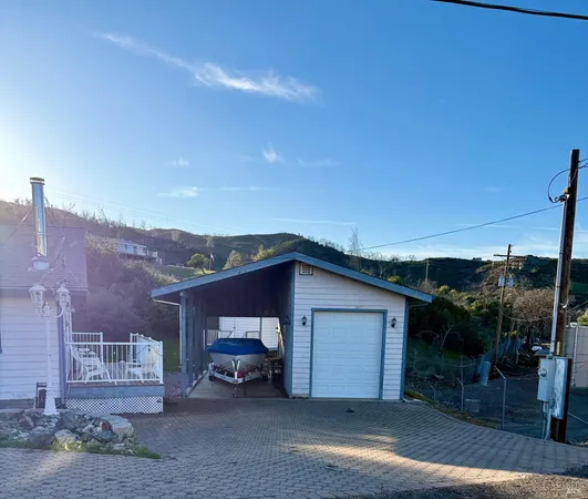a view of a house with a outdoor space and sitting space