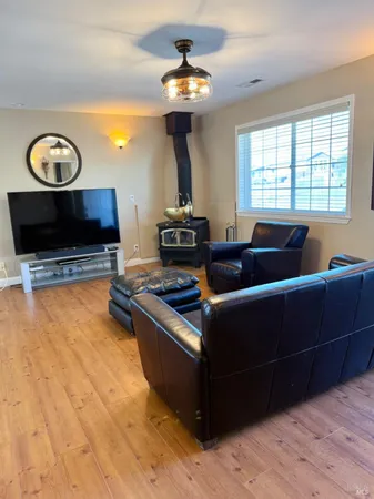 a living room with couches and a fireplace