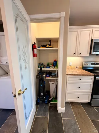 a kitchen with a refrigerator and a stove