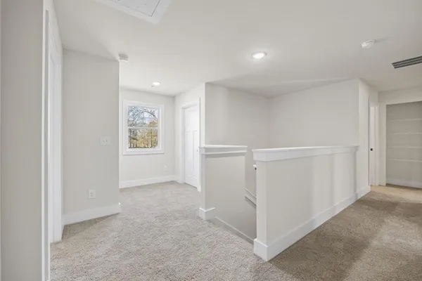 an empty room with closet area