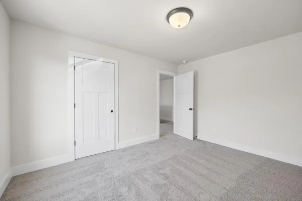 a white toilet sitting next to a bath tub