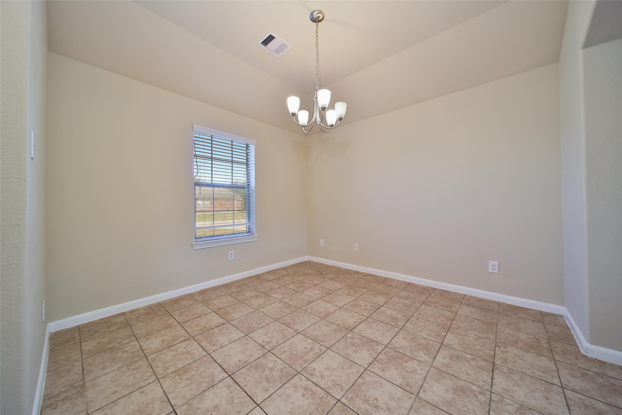 19134 Painted Boulevard Porter, TX 77365 - Photo 8 of 34 a view of a chandelier fan and a window