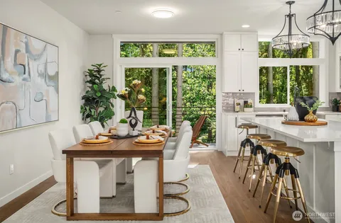 a view of a dining room with furniture window and outside view