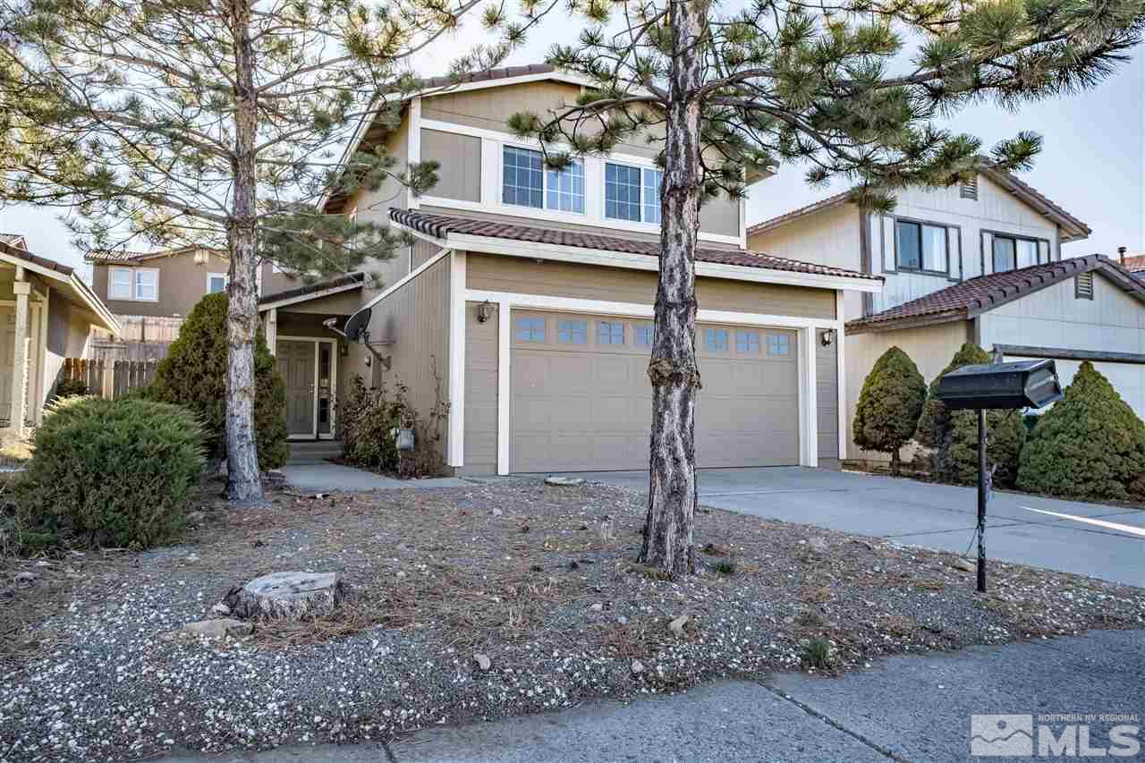 6890 Forsythia Way Reno, NV 89506 - Photo 2 of 17 a house that has a tree in front of the house