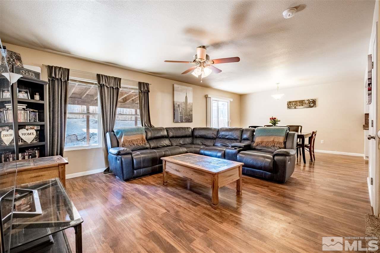 6890 Forsythia Way Reno, NV 89506 - Photo 3 of 17 a living room with furniture and wooden floor