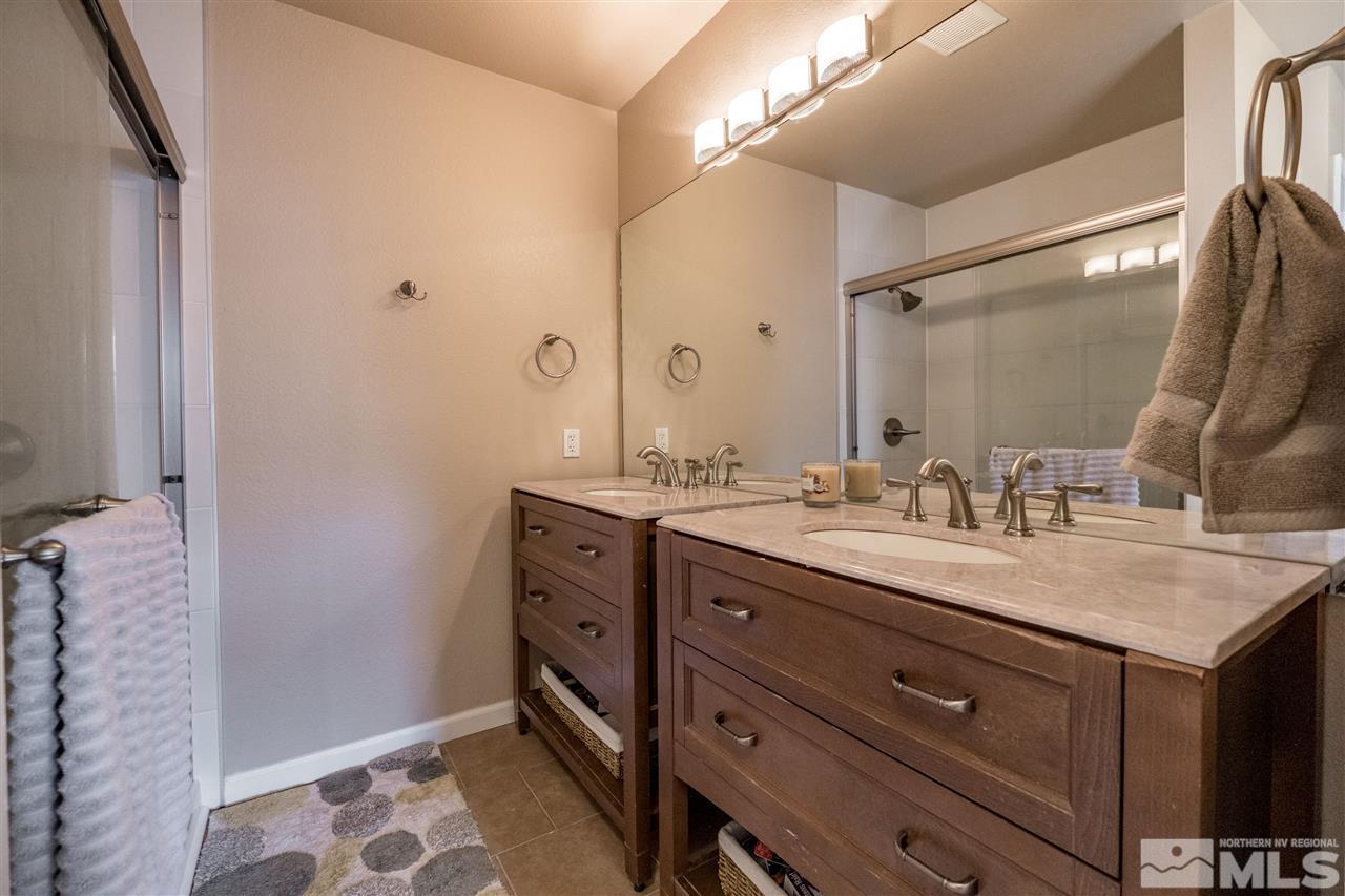 6890 Forsythia Way Reno, NV 89506 - Photo 9 of 17 a bathroom with a granite countertop sink mirror and double