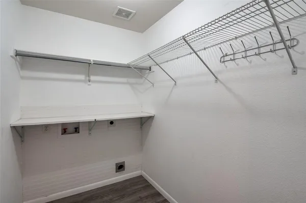 a view of a room with racks on the wall