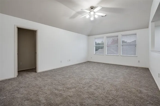 a view of empty room with fan