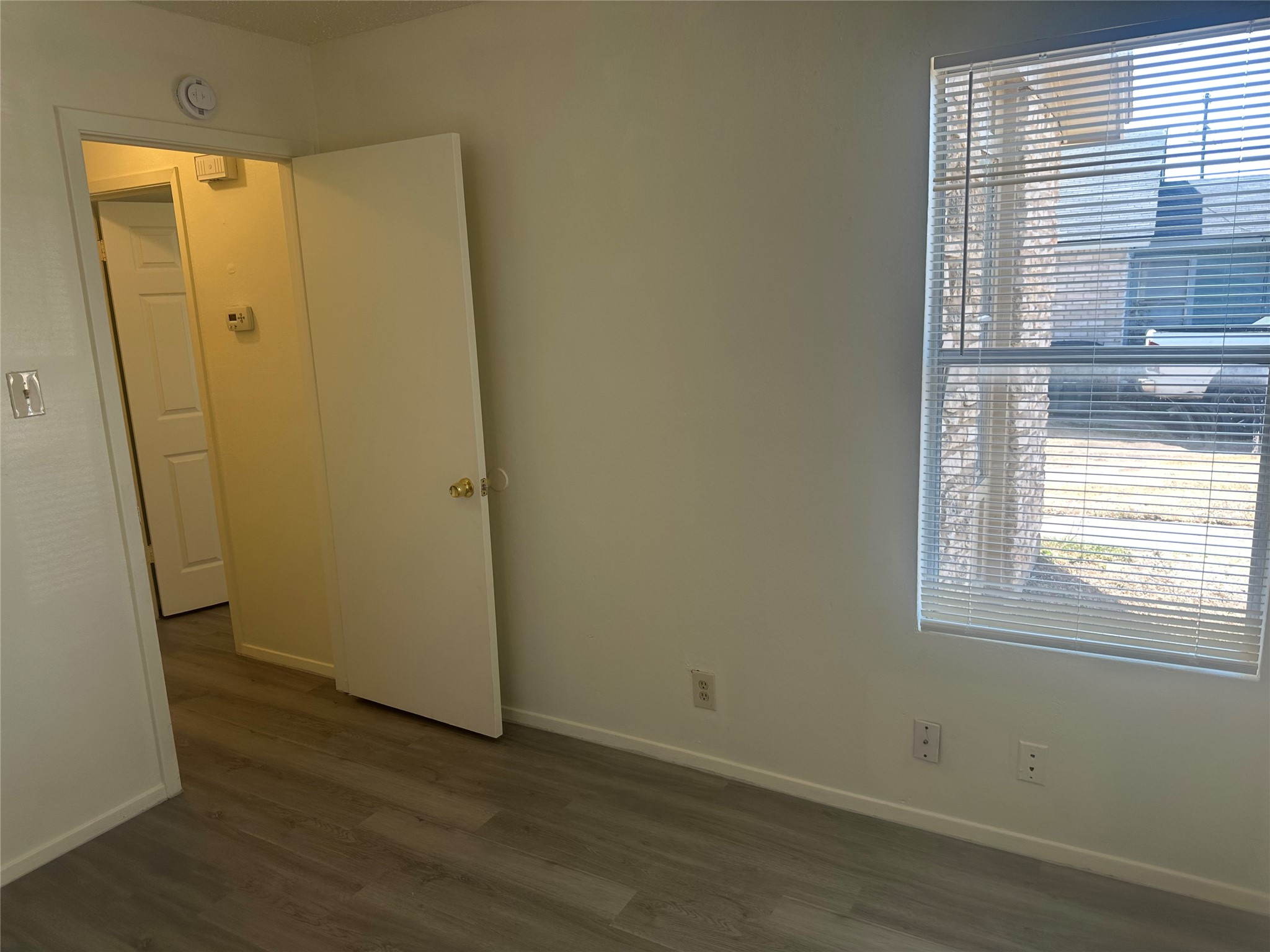 2602 South Bagdad Road, Unit B Leander, TX 78641 - Photo 16 of 23 Gleaming wood-look floors complement the clean lines of this versatile bedroom space.