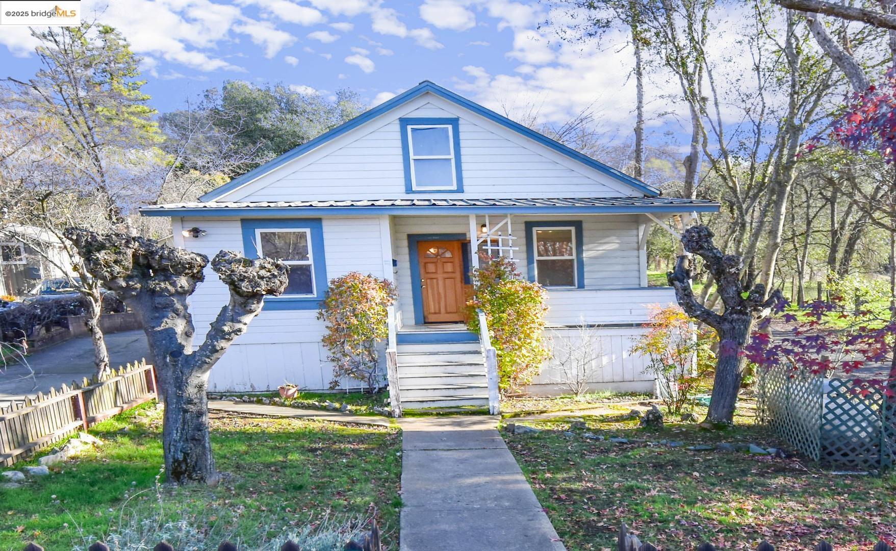 a front view of a house with garden