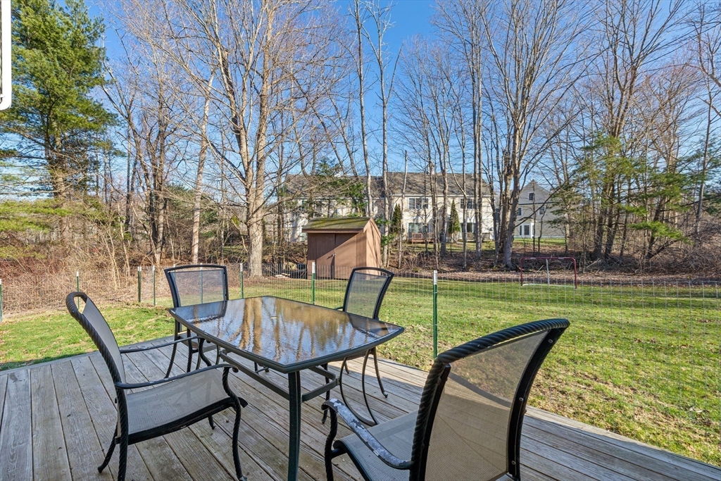 38 Brook Street Georgetown, MA 01833 - Photo 30 of 42 a view of a chairs and table in patio with a park