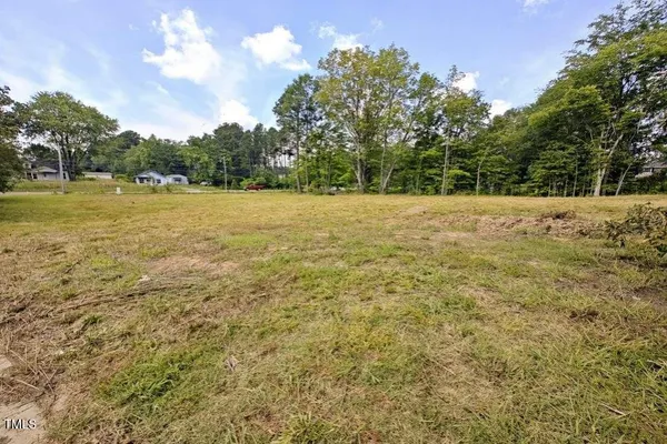 a view of a yard with an trees