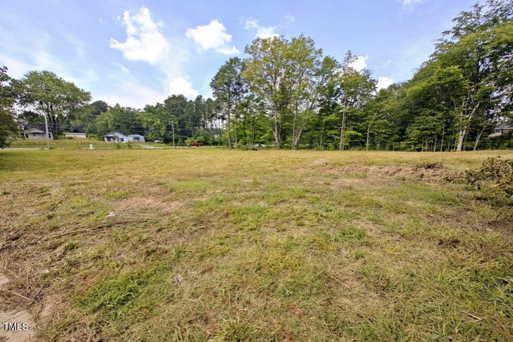 3857 Angier Avenue Durham, NC 27703 - Photo 3 of 7 a view of a yard with an trees