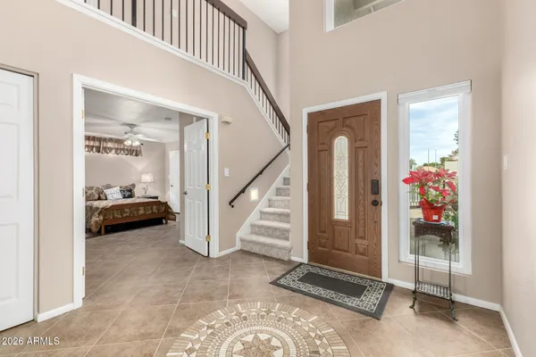 a view of a hallway view with staircase