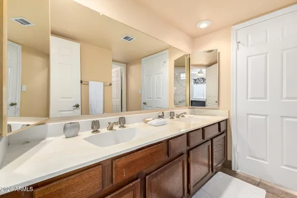 a bathroom with a sink double vanity and a mirror