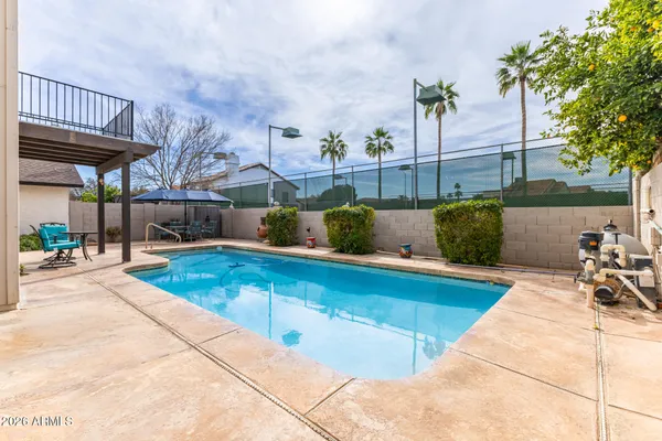 a view of a backyard with sitting area and furniture