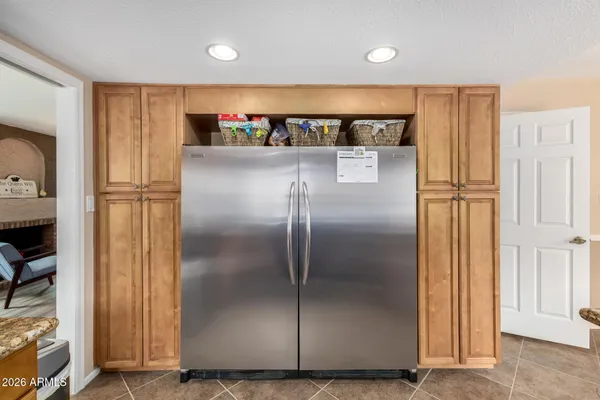 a view of a refrigerator in kitchen and a refrigerator
