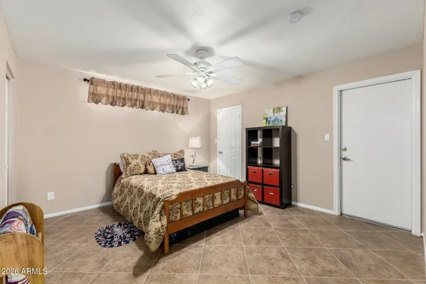 a bedroom with a bed and a bathroom