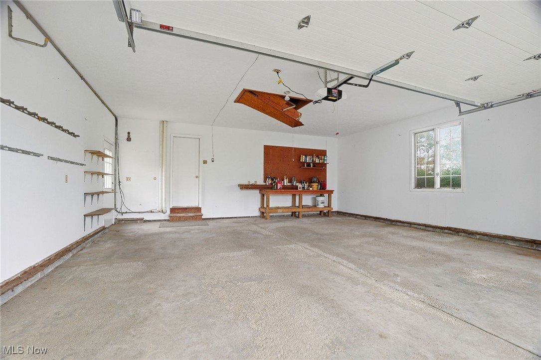 11710 Butternut Road Chardon, OH 44024 - Photo 40 of 48 Garage with a garage door opener freshly painted