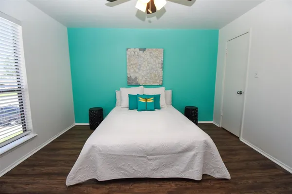 a bedroom with a bed and window