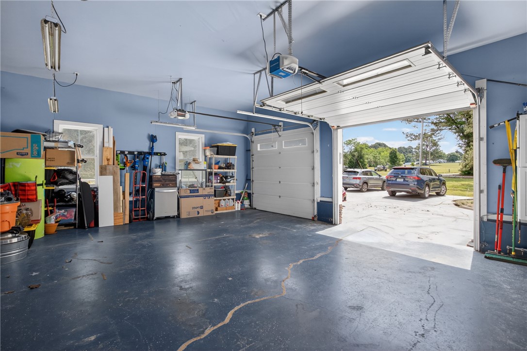 1504 Double Springs Road Townville, SC 29689 - Photo 15 of 41 This spacious garage offers ample room for vehicles and storage, with convenient access to the outdoors.