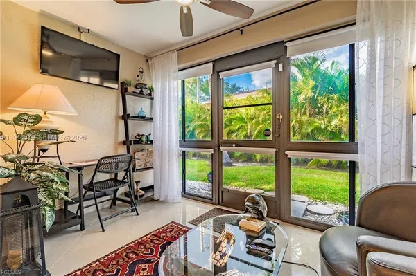 a living room with furniture and a flat screen tv