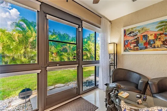 a room with furniture and a large window