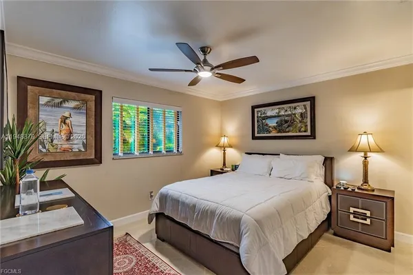 a bedroom with a bed and a desk