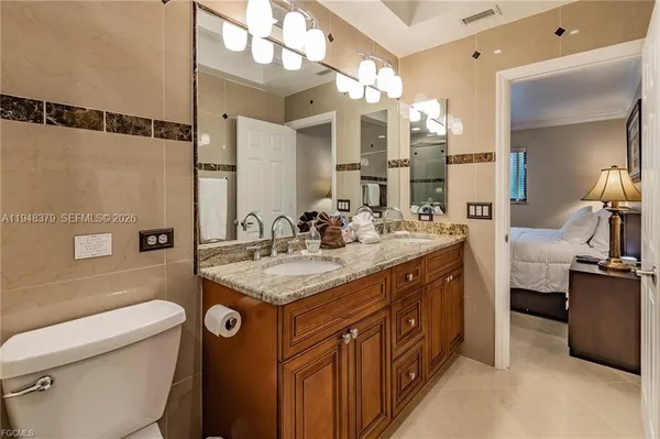 a bathroom with a sink double vanity and a mirror