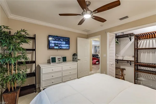 a bedroom with a bed dresser and a window