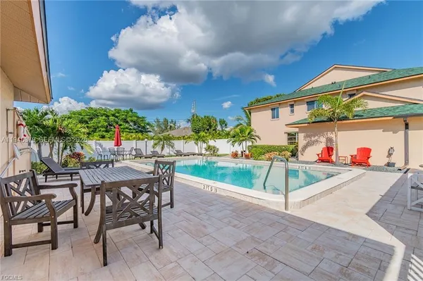 a view of a chairs and table in the patio