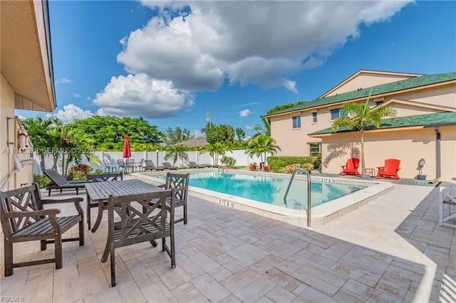 a view of a chairs and table in the patio