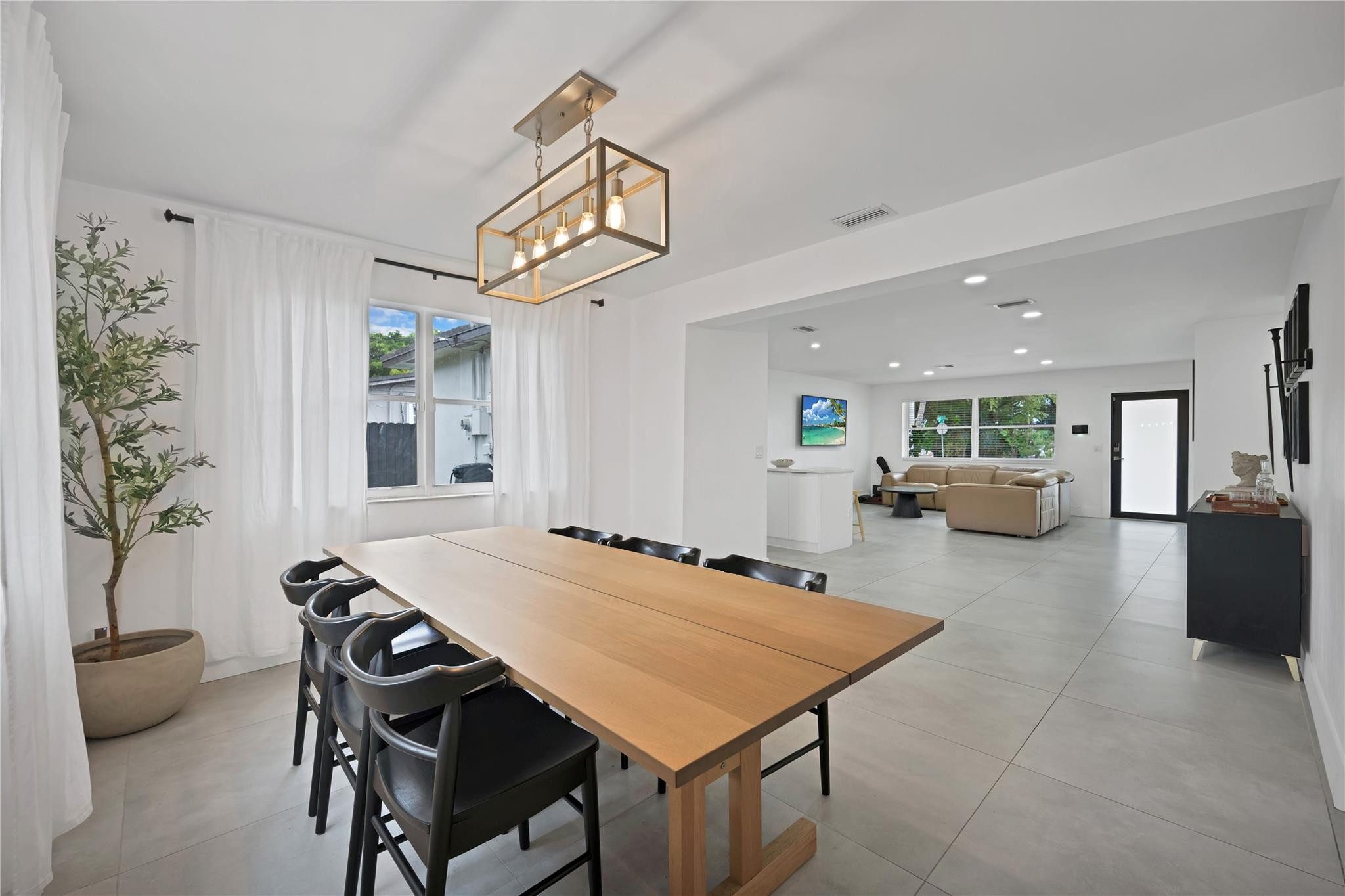 300 Southwest 65th Way Pembroke Pines, FL 33023 - Photo 13 of 35 a view of a dining room with furniture and a potted plant