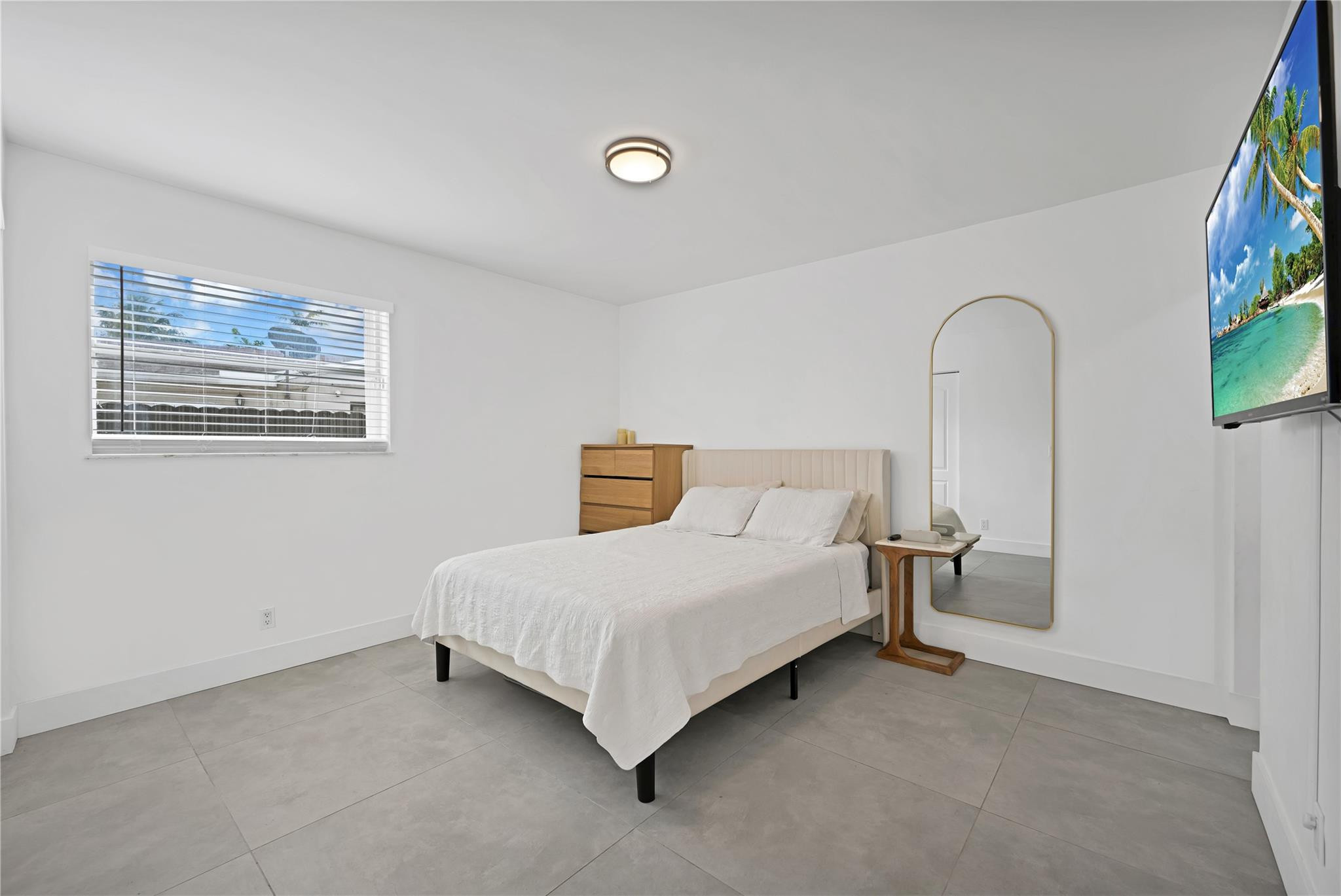 300 Southwest 65th Way Pembroke Pines, FL 33023 - Photo 16 of 35 a bedroom with a bed and a painting on the wall