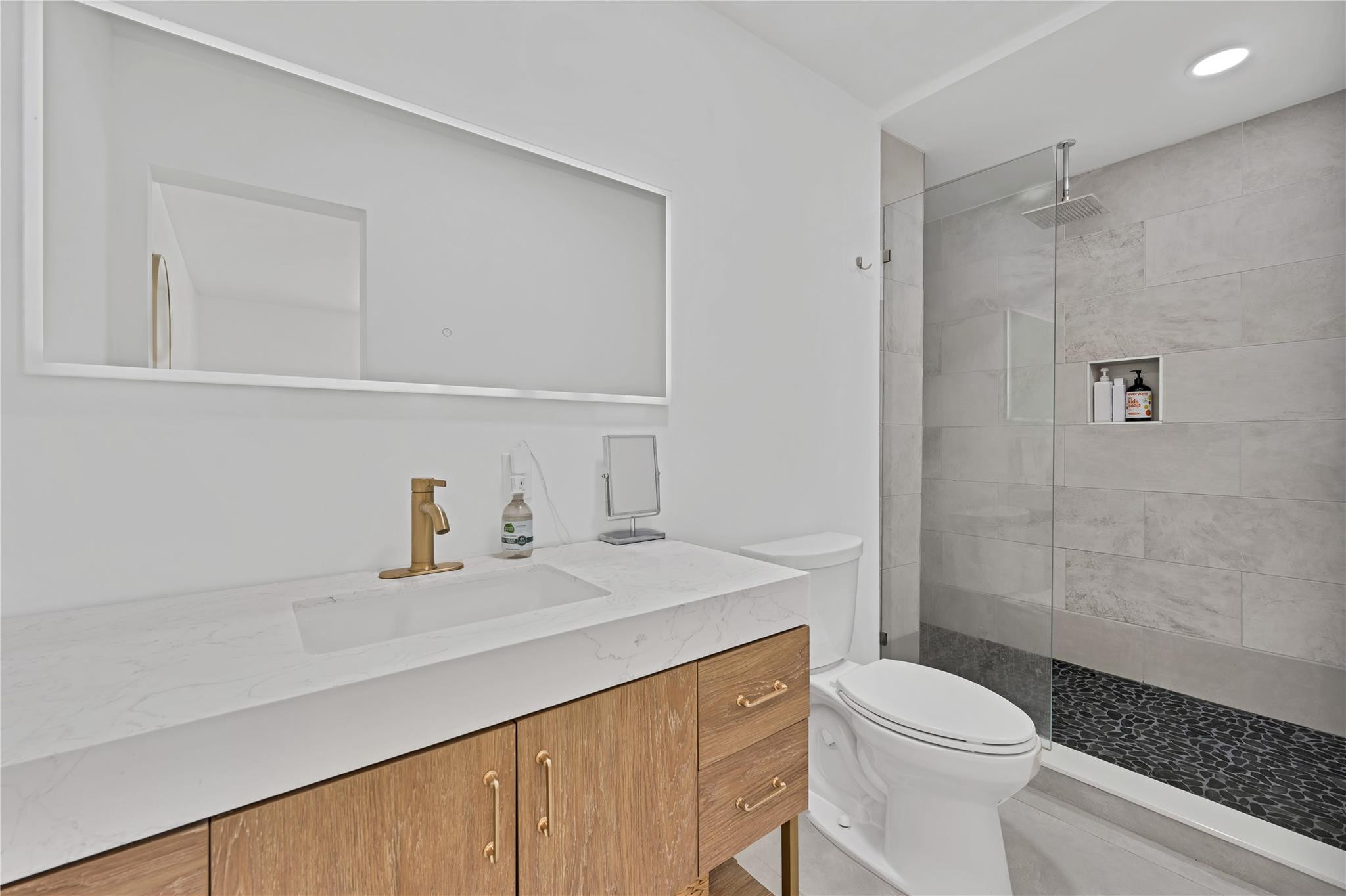 300 Southwest 65th Way Pembroke Pines, FL 33023 - Photo 18 of 35 a bathroom with a sink a toilet and shower