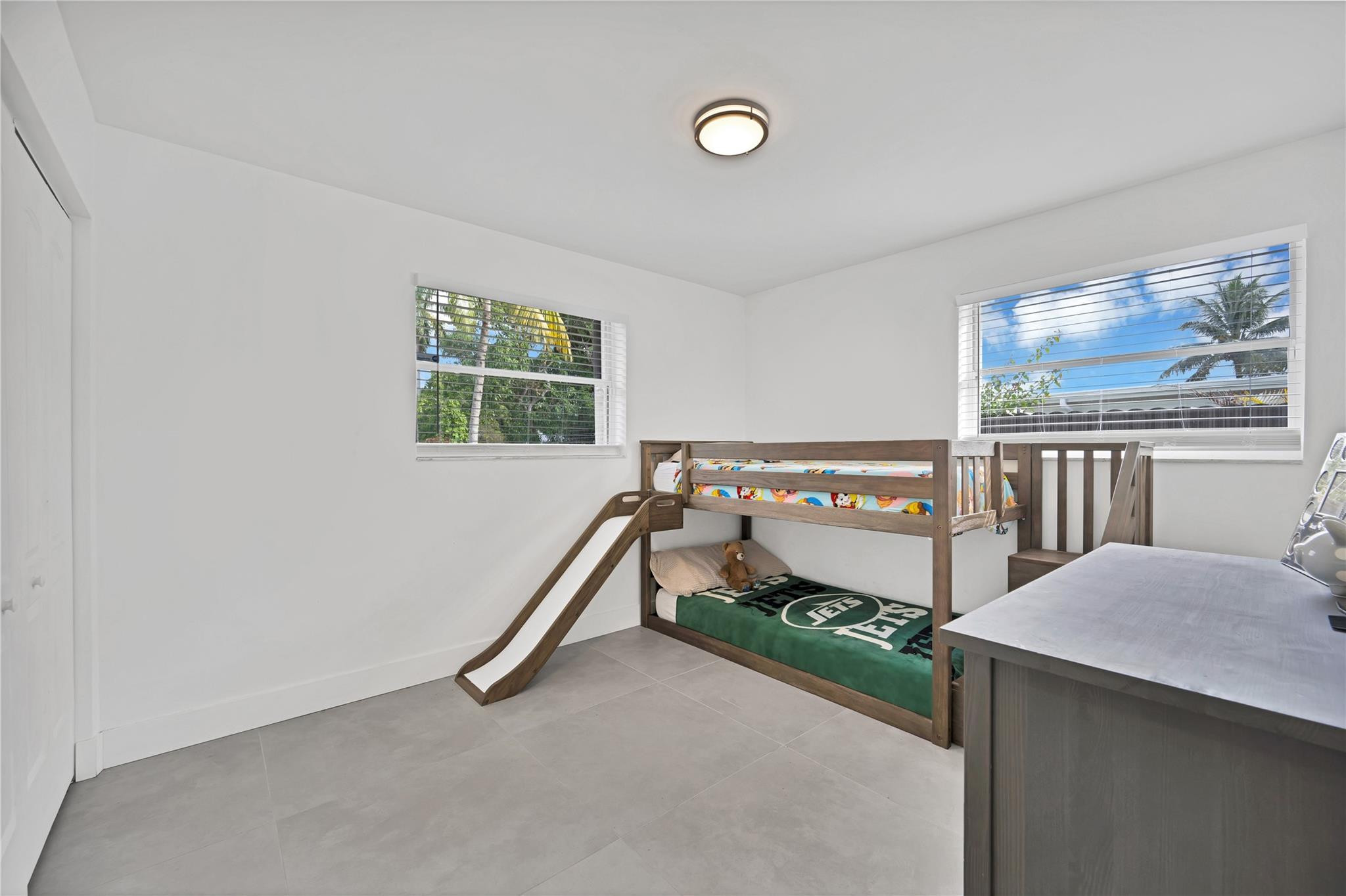 300 Southwest 65th Way Pembroke Pines, FL 33023 - Photo 22 of 35 a bedroom with furniture and a window