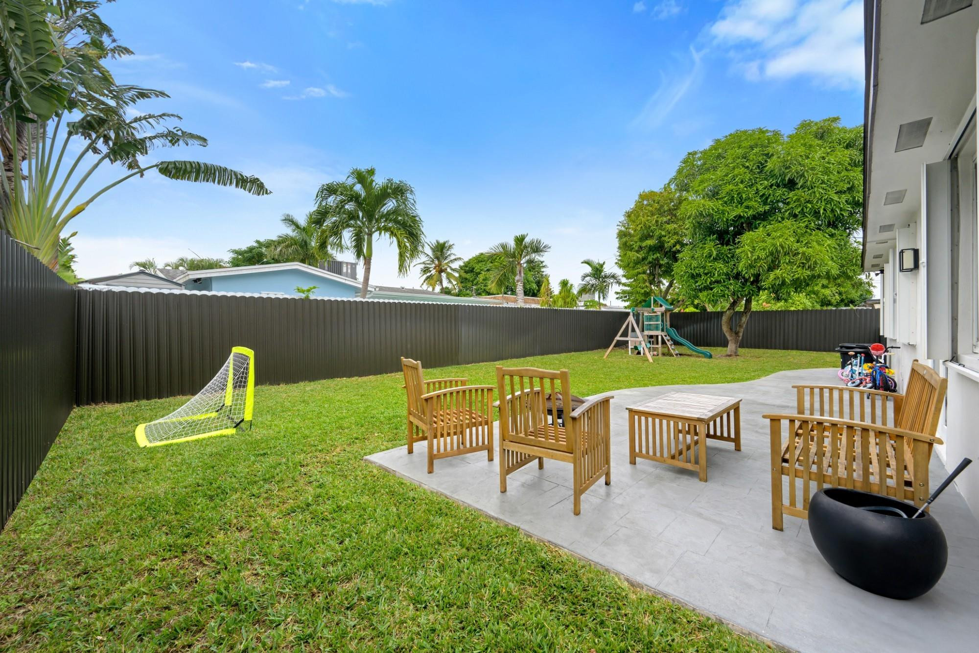 300 Southwest 65th Way Pembroke Pines, FL 33023 - Photo 25 of 35 a view of a chair and table on the patio