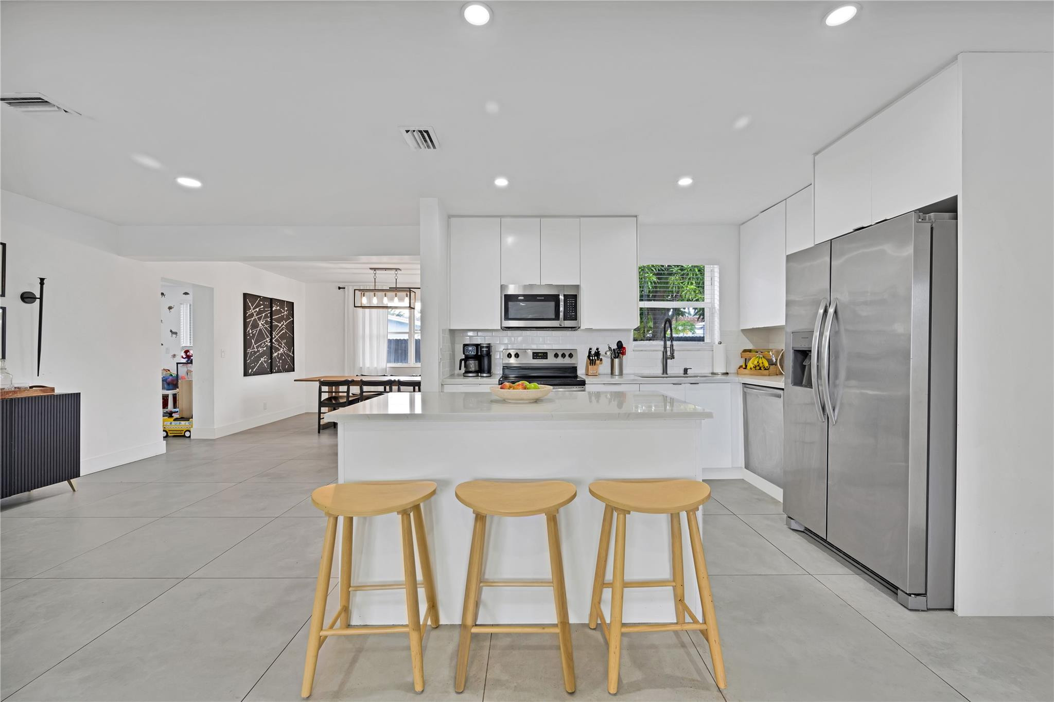300 Southwest 65th Way Pembroke Pines, FL 33023 - Photo 6 of 35 a large kitchen with a table and chairs