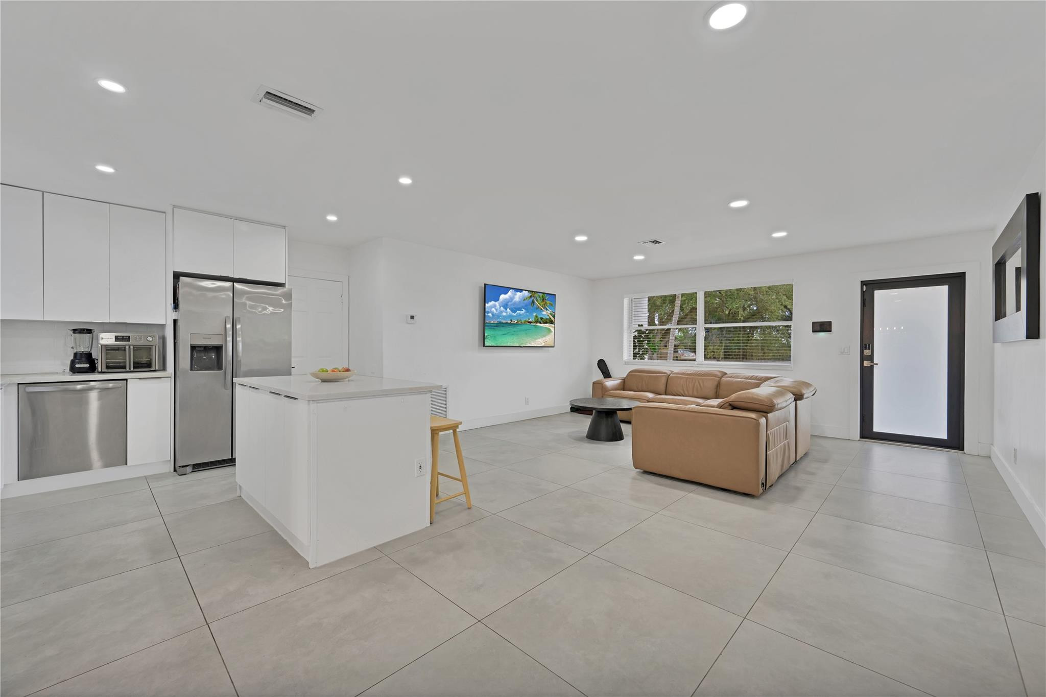 300 Southwest 65th Way Pembroke Pines, FL 33023 - Photo 8 of 35 a living room with furniture and a kitchen