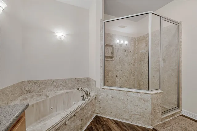 a bathroom with a granite countertop sink mirror and vanity