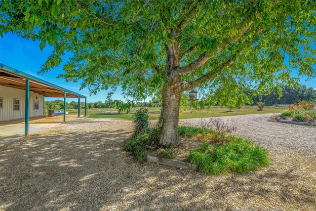 a kitchen with a sink cabinets and wooden floor