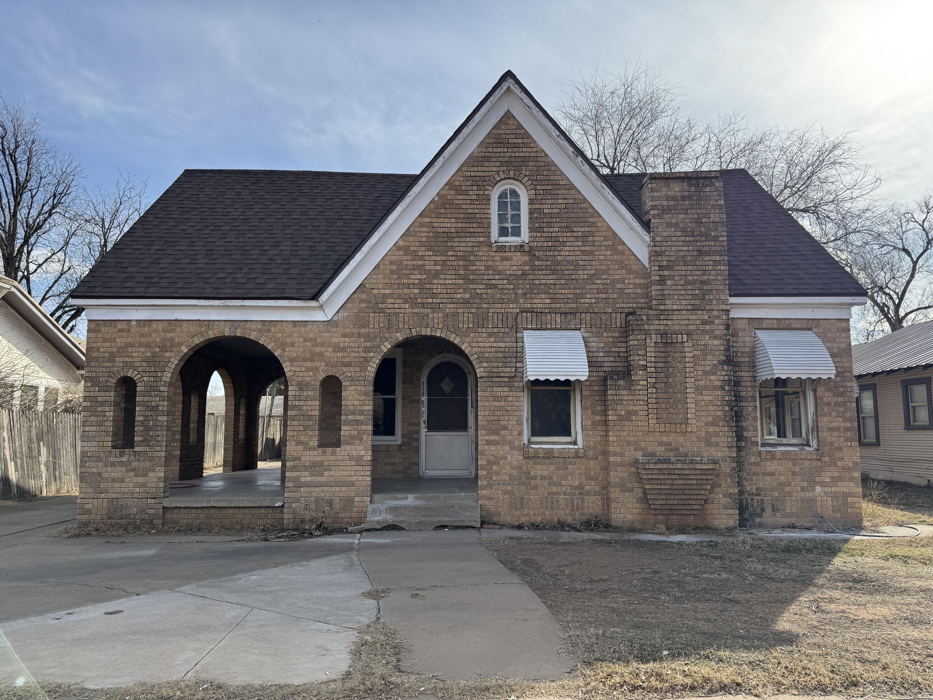 1903 16th Street, Unit A Lubbock, TX 79401 - Photo 1 of 7 a front view of a house with large windows