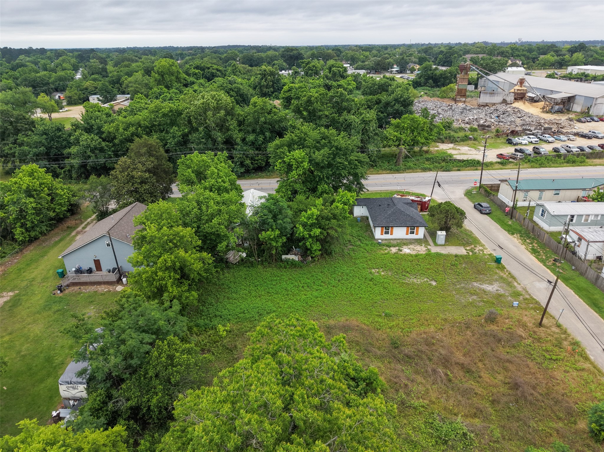 0 Mill Street Willis, TX 77378 - Photo 9 of 24 aerial view of a house with a yard