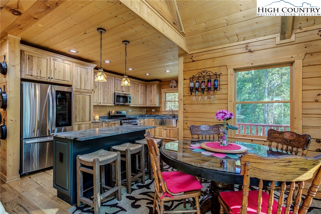 3460 South Center Church Road Thurmond, NC 28683 - Photo 17 of 50 a view of a dining room with furniture window and wooden floor