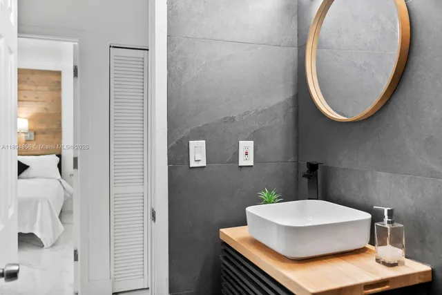 a bathroom with a sink and a mirror