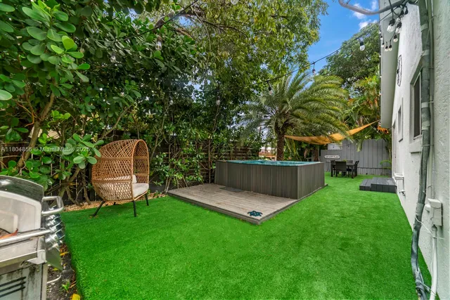 a view of a tiny house with a backyard