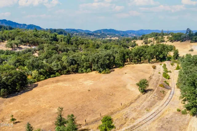 a view of a yard with a mountain