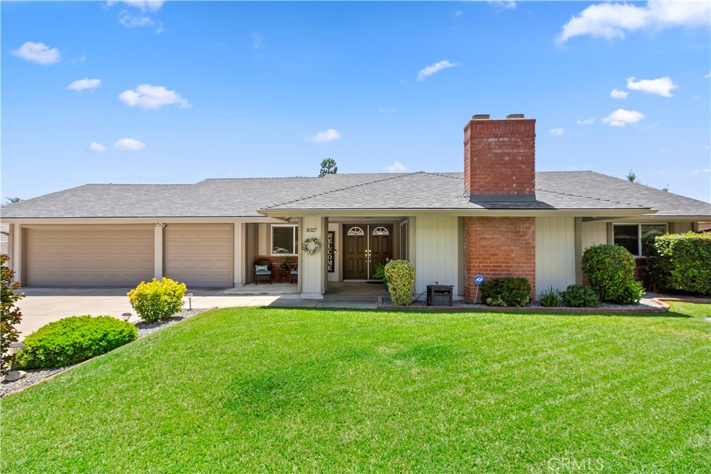 8527 Hillside Road Rancho Cucamonga, CA 91701 - Photo 4 of 50 a front view of a house with a yard and porch